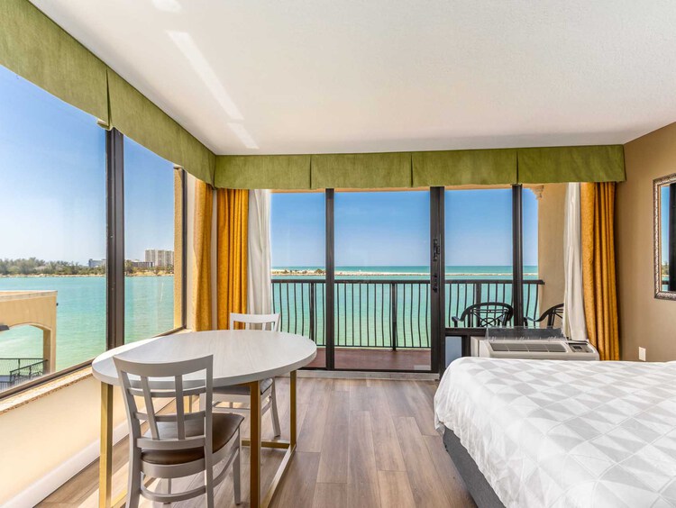 King bed guest room with a private balcony