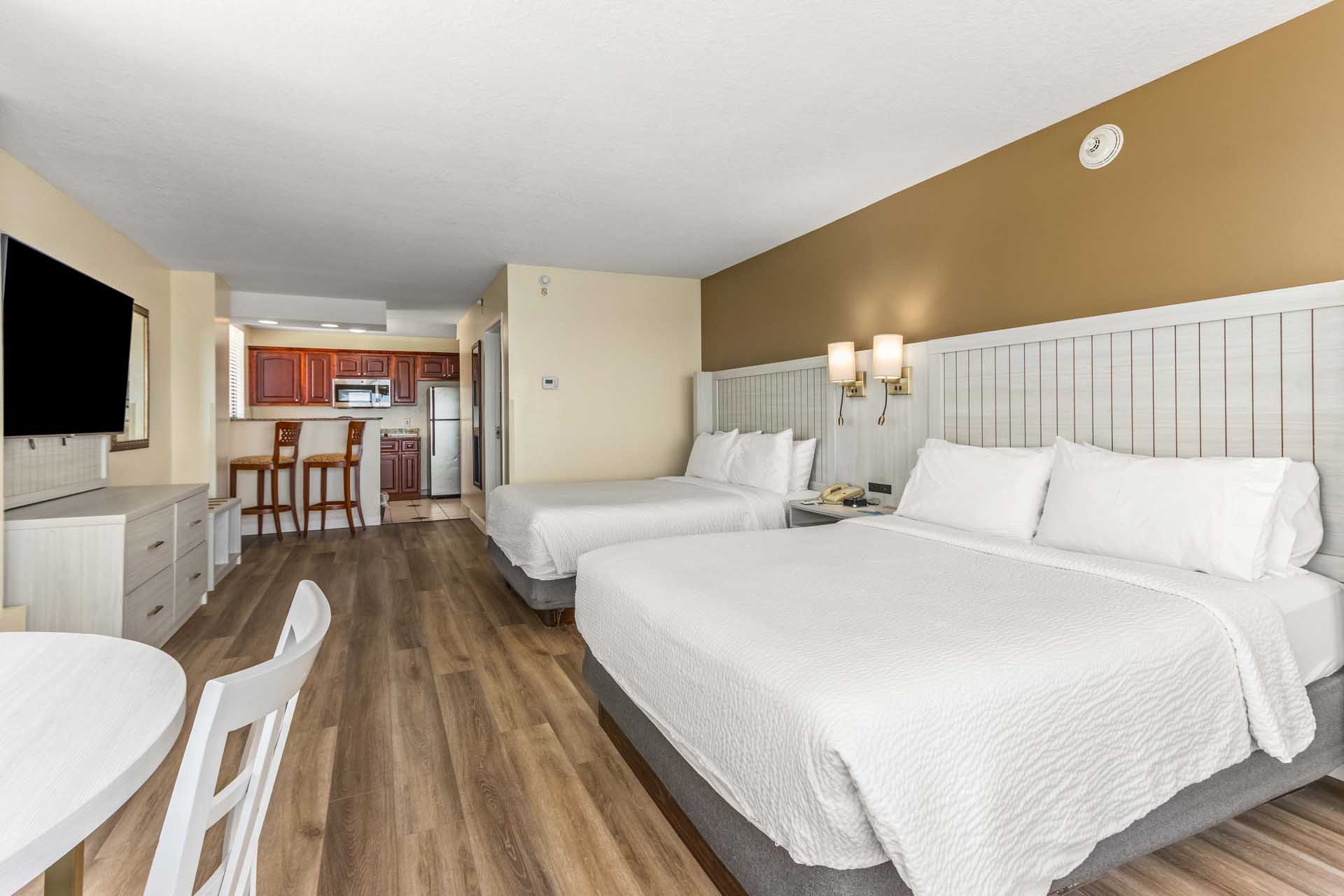 Two queen beds with a TV