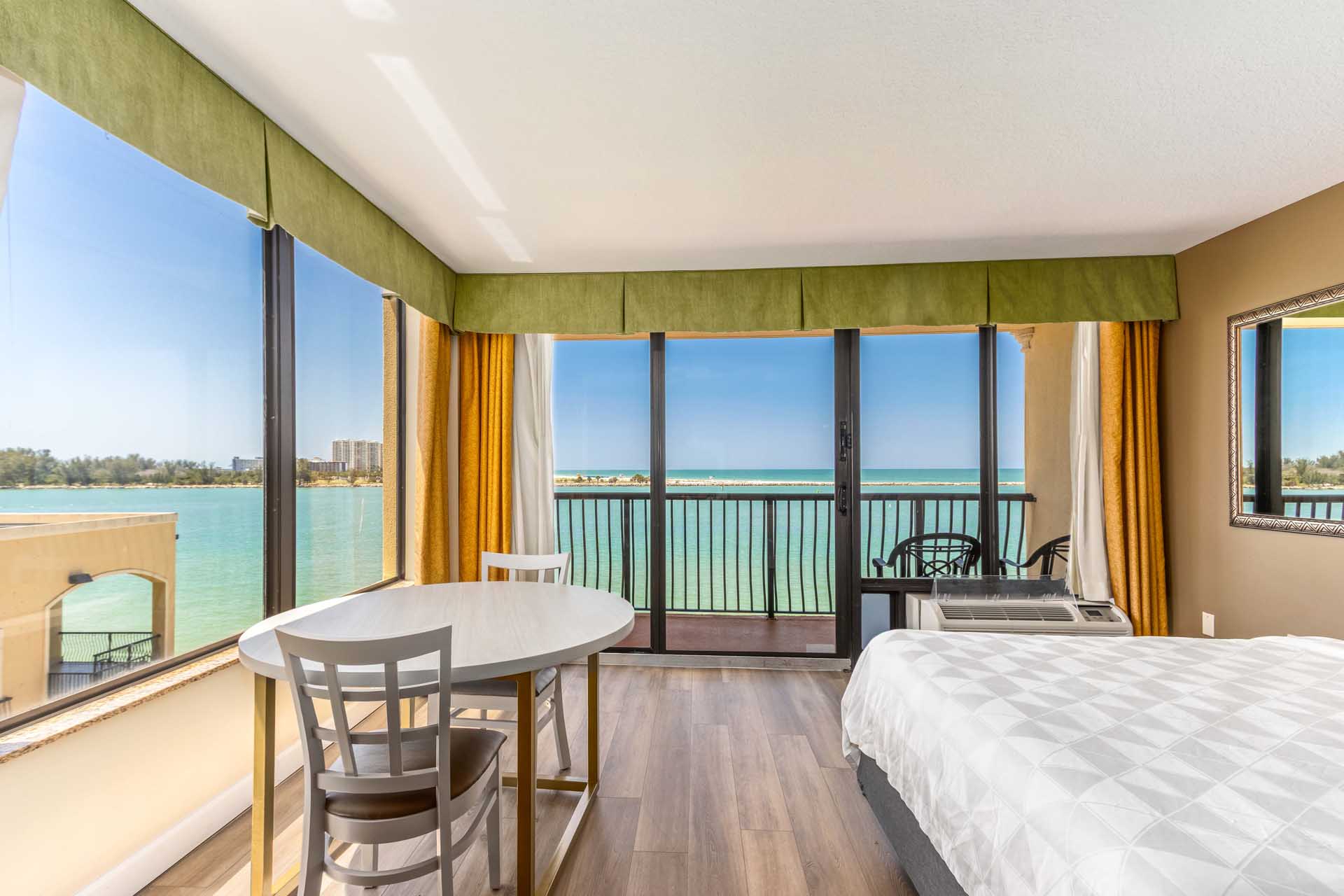 King bed guest room with a private balcony