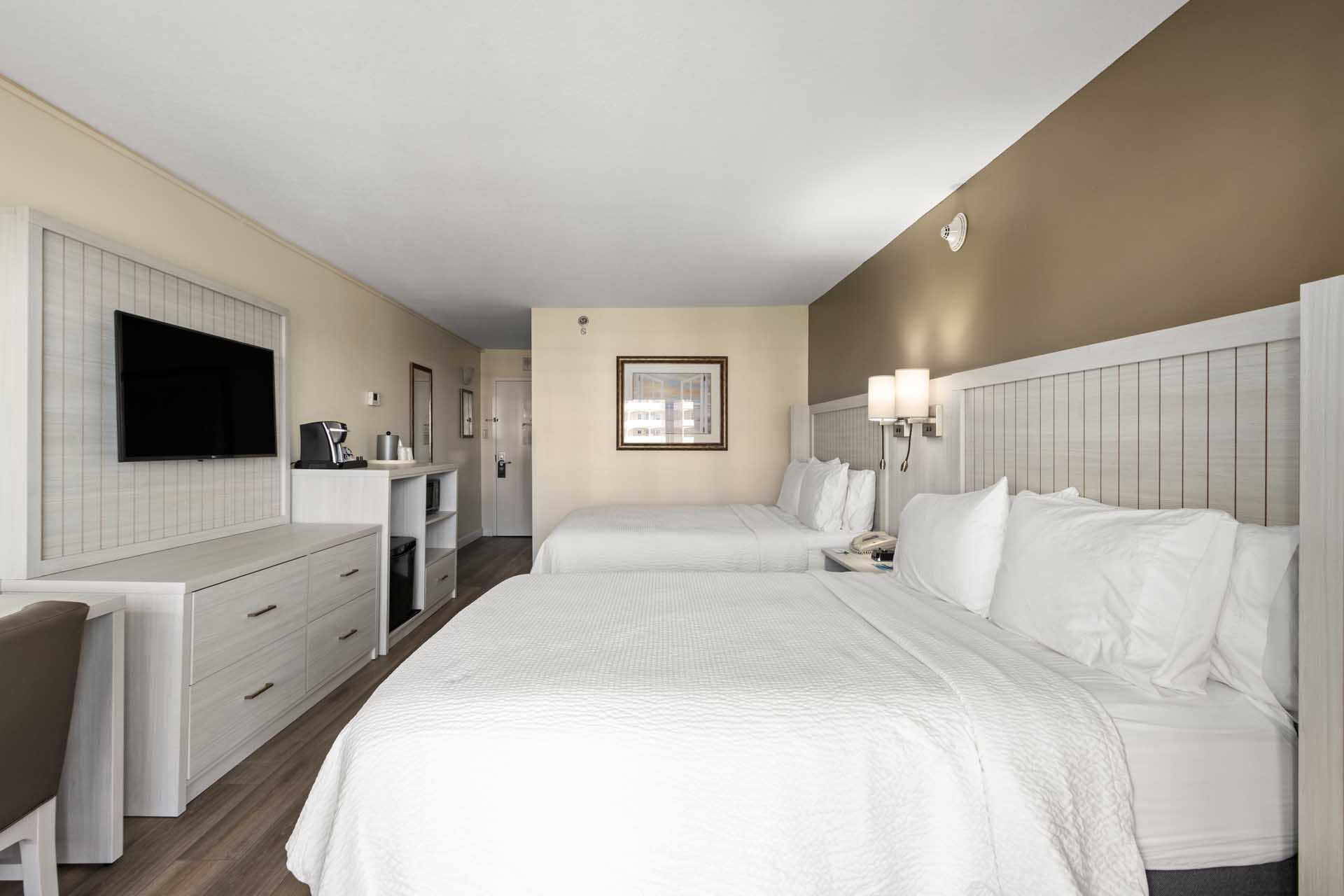 Two queen beds and a TV