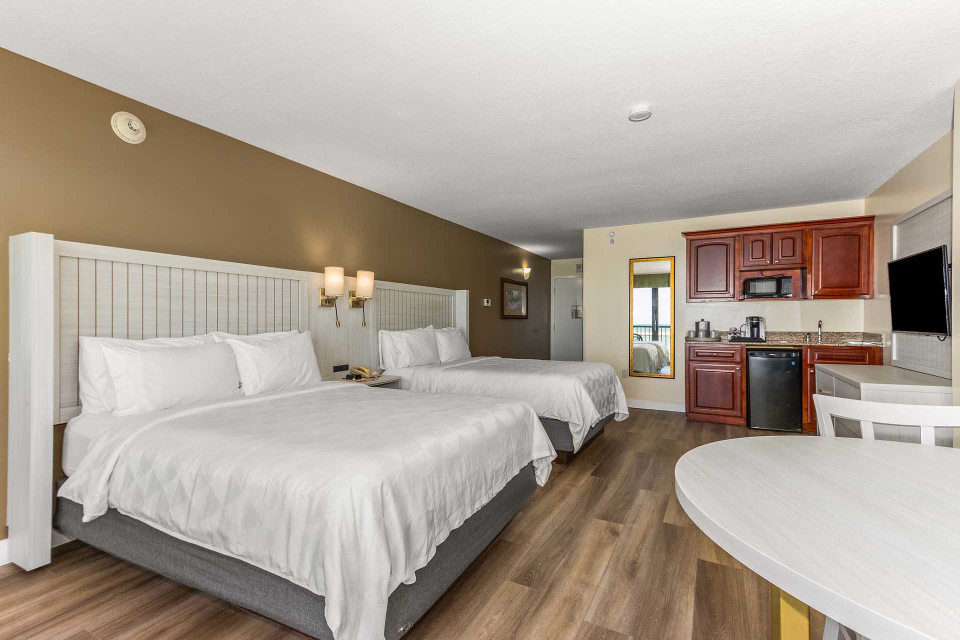 Two queen beds and a kitchenette