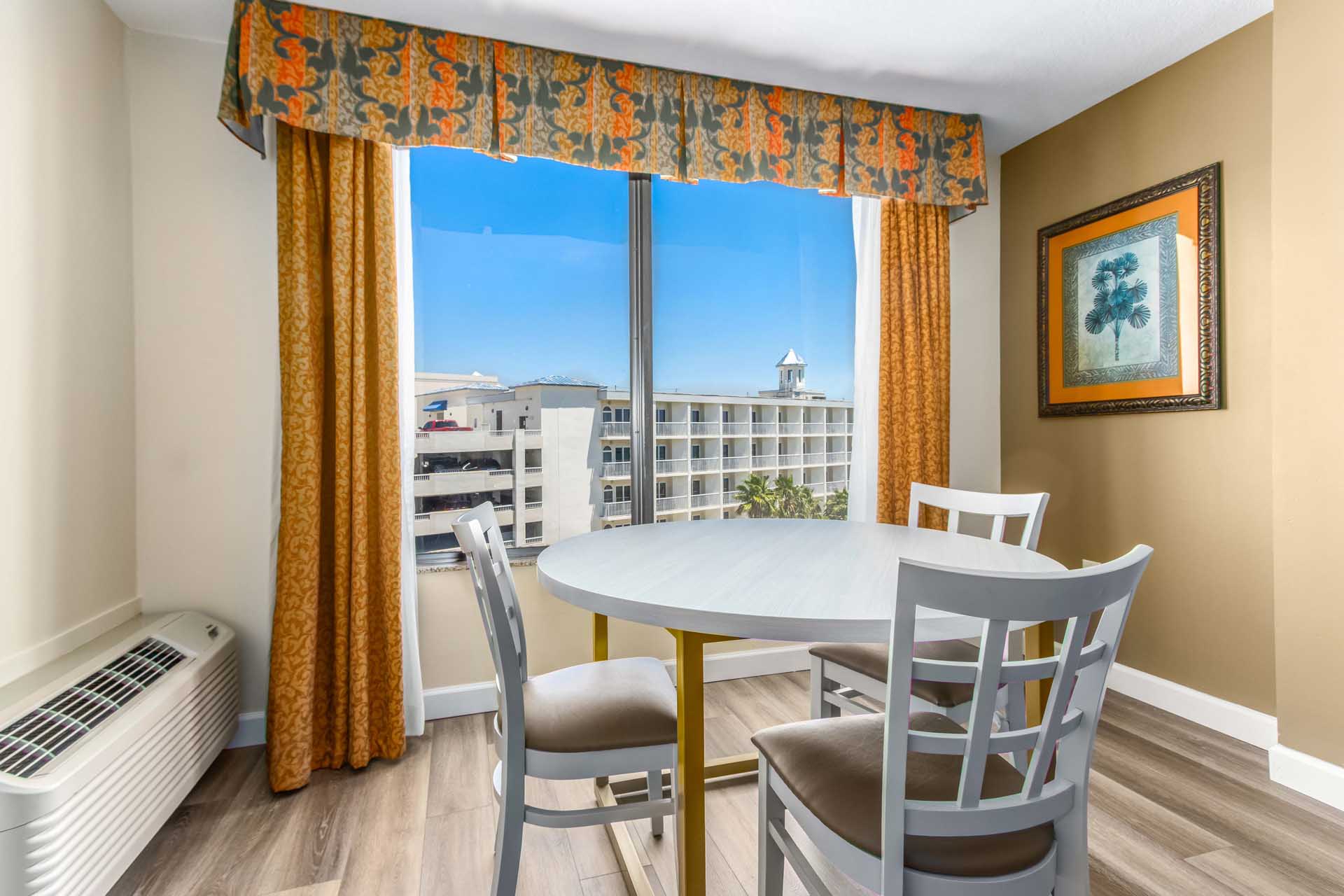 Dining table area with a balcony